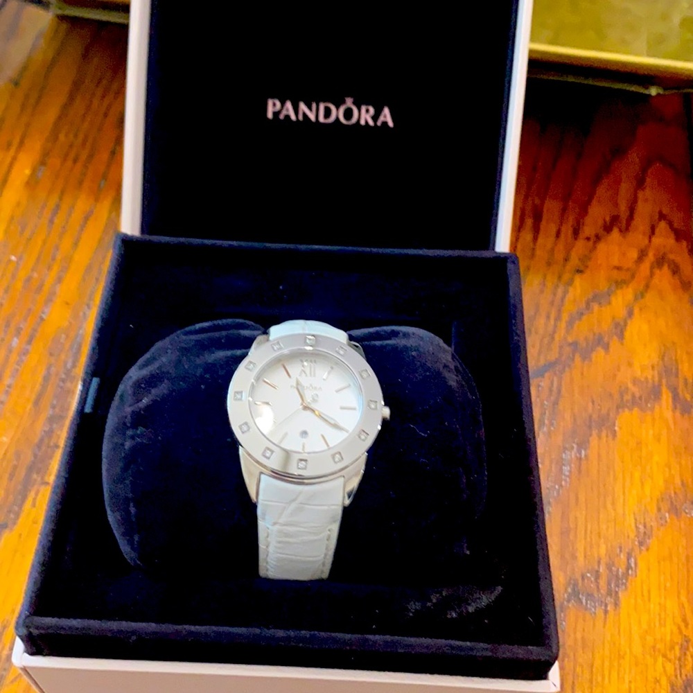 Pandora white leather band watch.